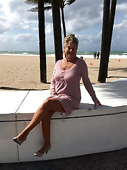 Mature damsel is taking off her panties